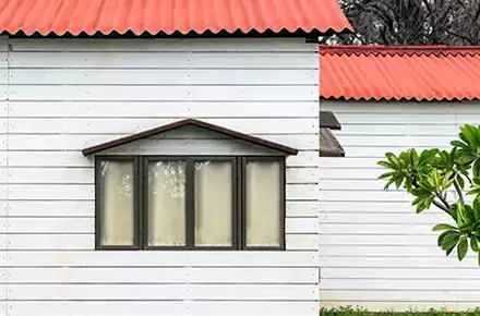 White wall panels cladding on the exterior of a house | Everest Industries